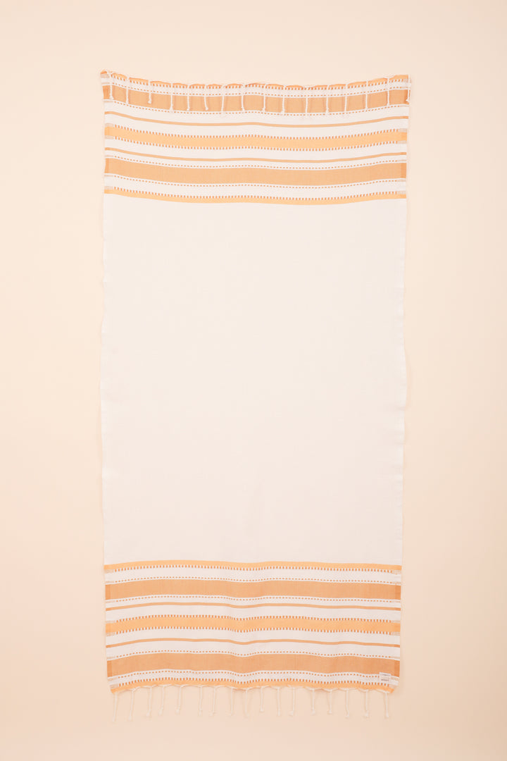 Serviette de plage 'fouta' LYOUM aux rayures jaunes.