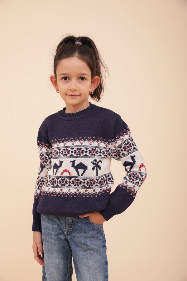 Enfant en pull de Noël LYOUM bleu.