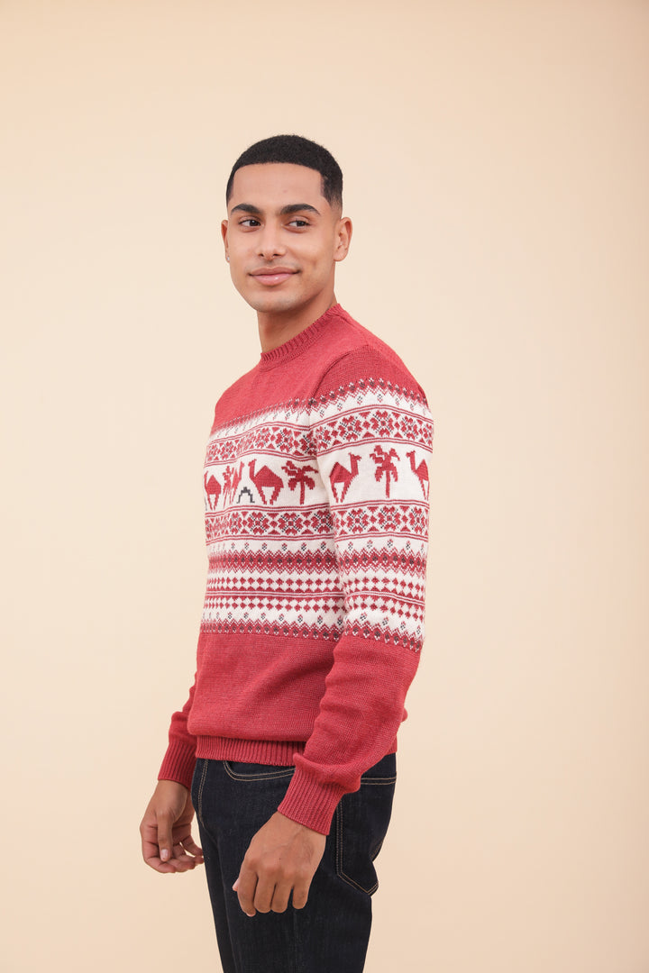 Homme de profil en pull de Noël LYOUM rouge.