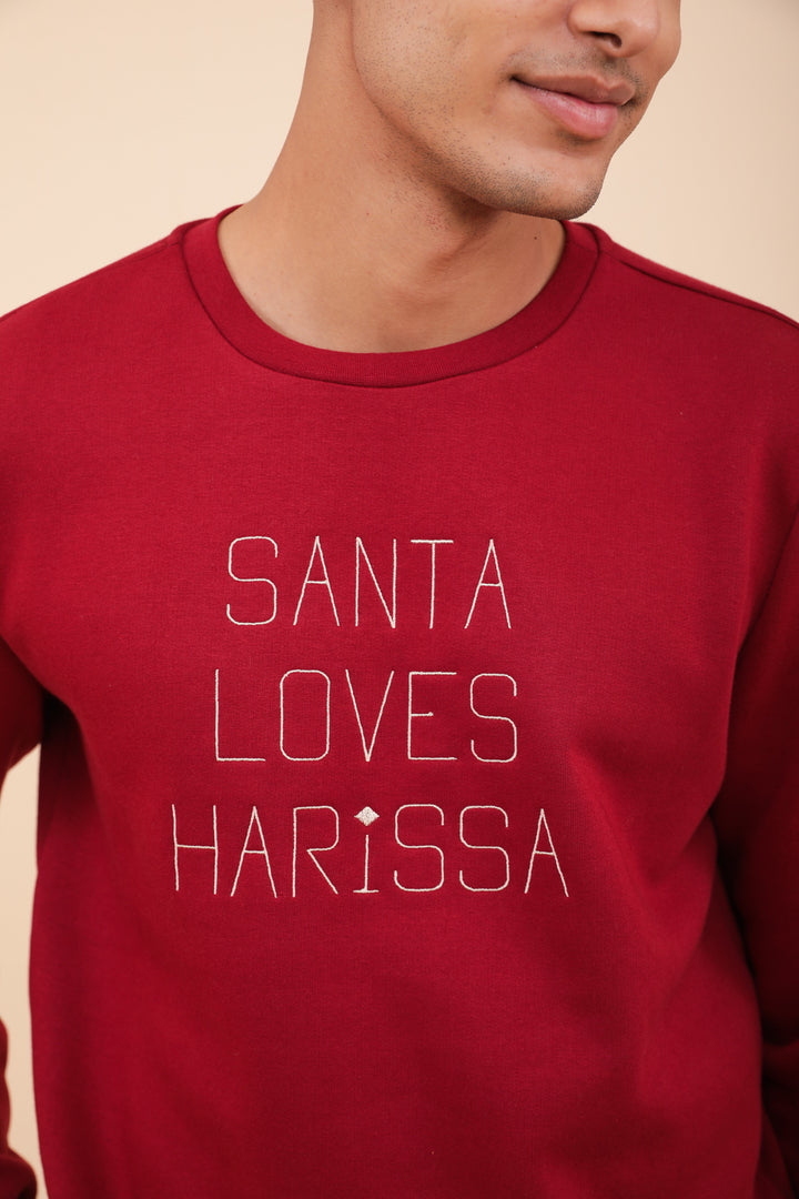 Broderie Santa Loves Harissa sur sweat LYOUM rouge.