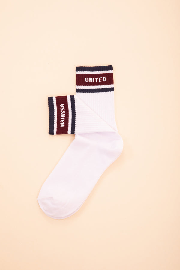 Chaussettes LYOUM blanches avec Harissa et United écrites.