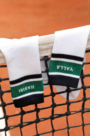 Chaussettes blanches mi-hautes avec rayures navy et vert et signature LYOUM 'Yalla' tricoté sur un côté et 'Habibi' de l'autre.