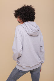 Nouveau sweat à capuche pour femme. Une coupe loose décontractée, des manches légèrement tombantes pour un look street casual, irrésistible.