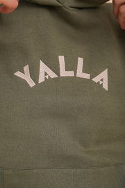 Signature LYOUM : broderie 'Yalla' sur le devant, en fil beige clair.