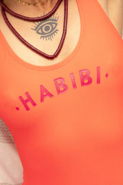 Nouveau maillot de bain Habibi by LYOUM, couleur corail. Notre message iconique Habibi ('mon amour' en arabe) sur le devant. Facile à porter, esprit casual et indémodable.