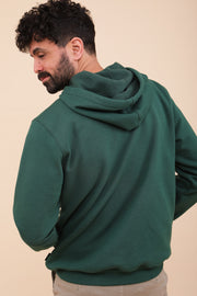 Signature LYOUM : le 'hoodie', sweat à capuche en molleton. Coupe impeccable, droite et indémodable, couleur exclusive, vert forêt.