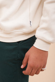 Signature LYOUM : le 'hoodie', sweat à capuche en molleton. Coupe impeccable, droite et indémodable, manches longues, capuche et cordons. On le porte tous les jours !